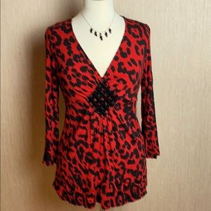 Sexy top with black rhinestone accents.